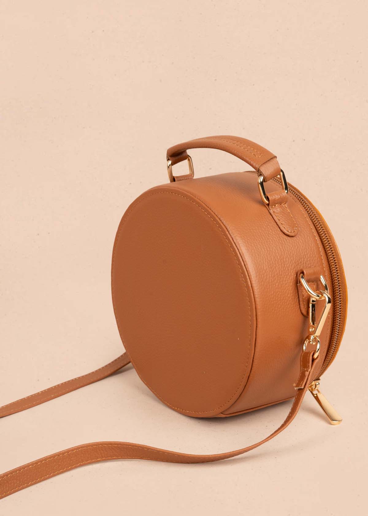 Bolso tipo bandolera en cuero color tabaco y cuero con pelo animal print 105312