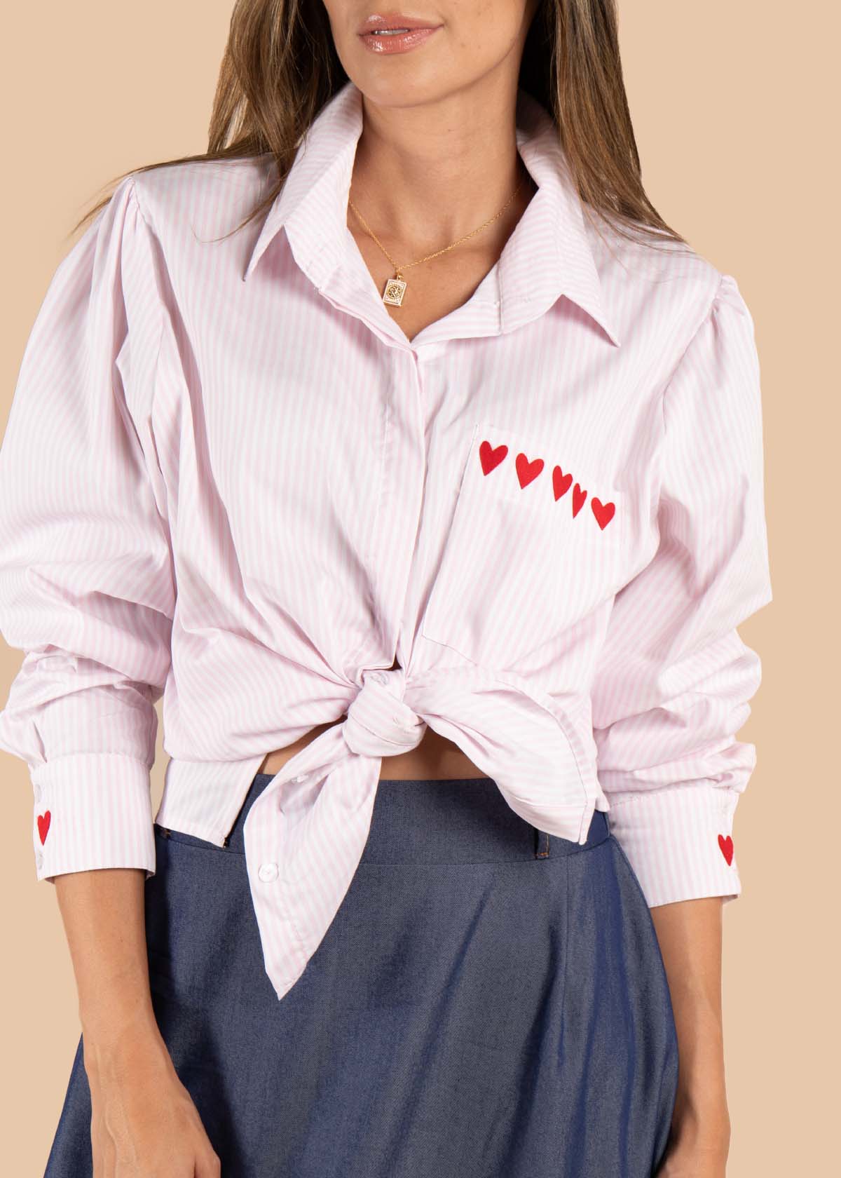 Blusa color rosado con rayas y corazones 105611
