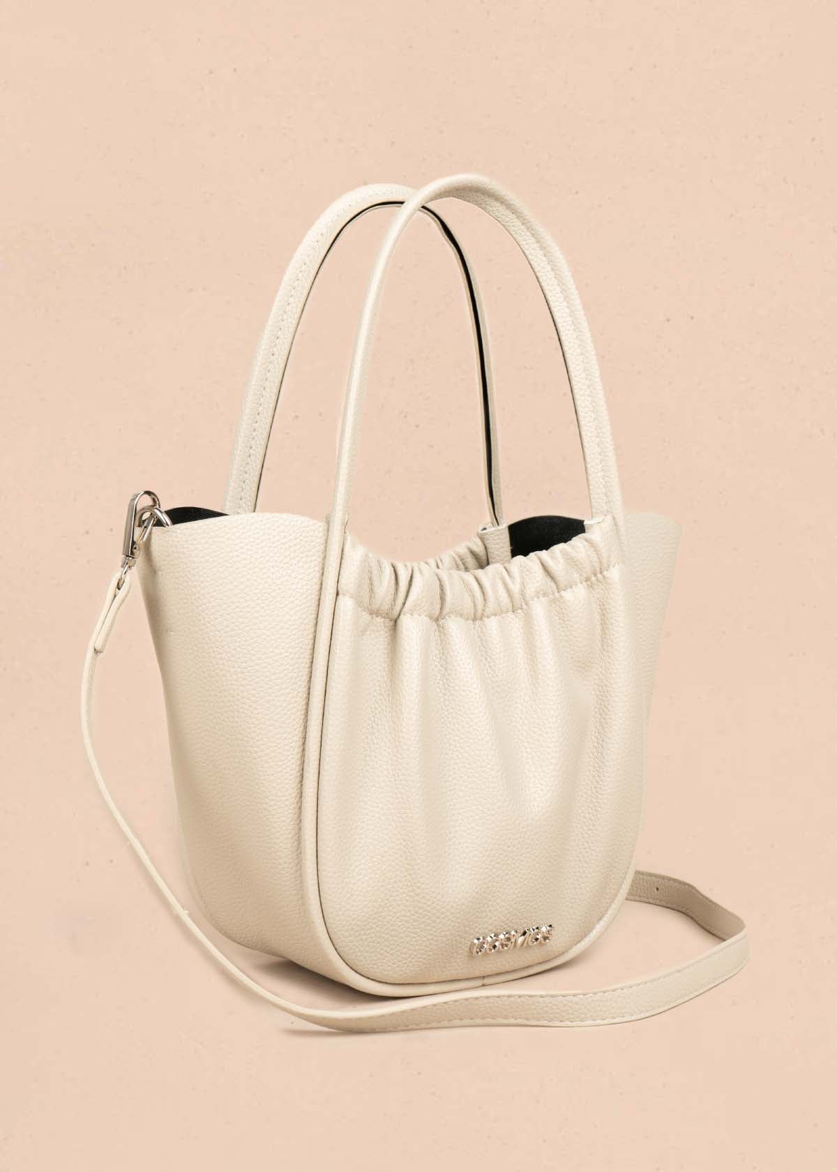Bolso tipo cartera color beige con resorte 105702