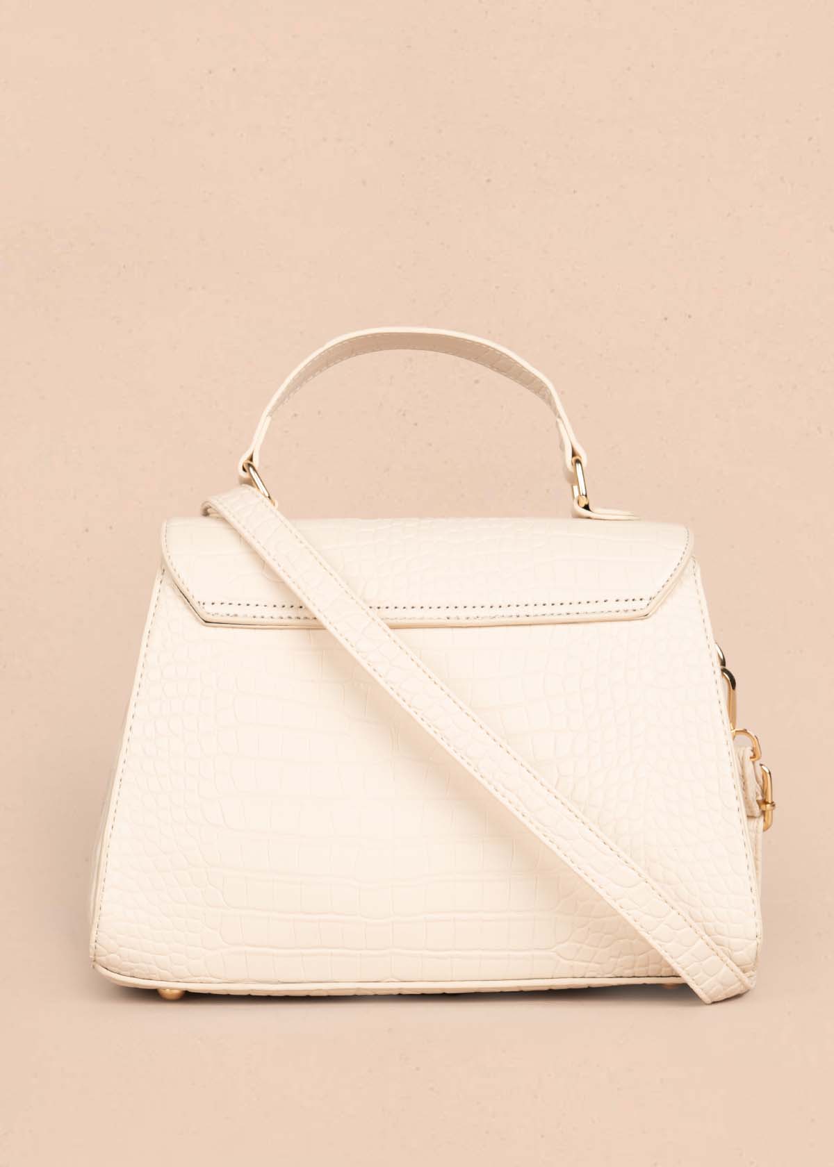 Bolso manos libres color crema con textura croco 105772