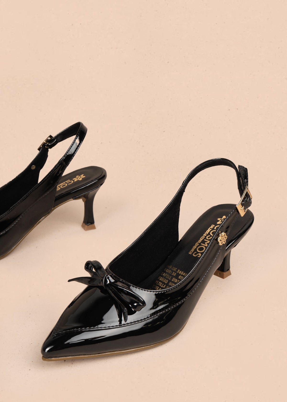 Trabilla color negro con punta fina y moño decorativo 106088