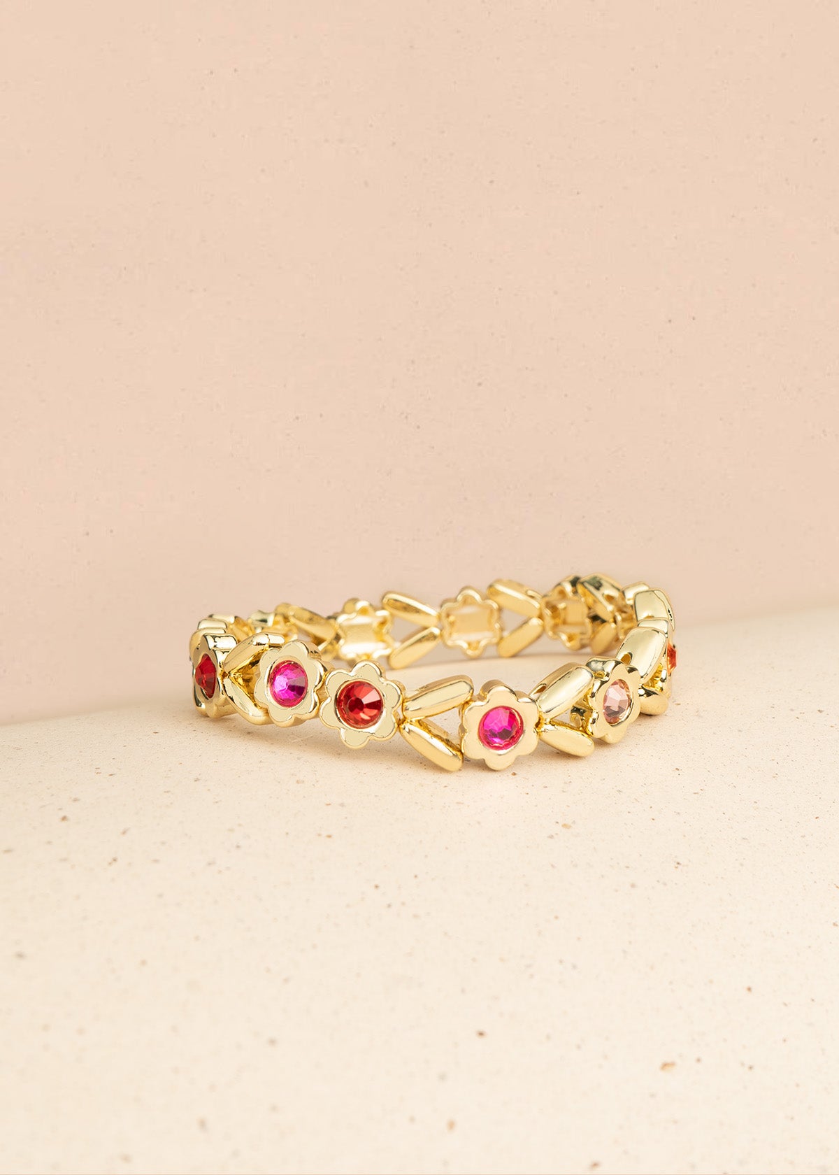 Pulsera color dorado en eslabón de flores con cristales 106402