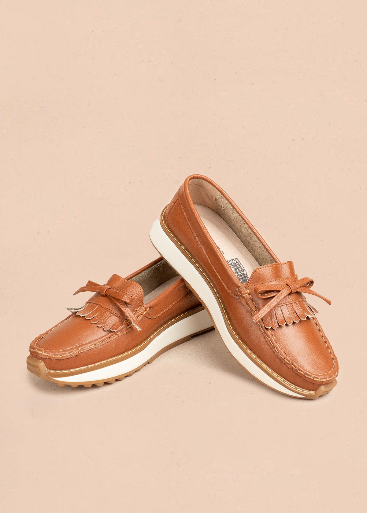 Mocasines en cuero color miel con flecos y lazo 106548