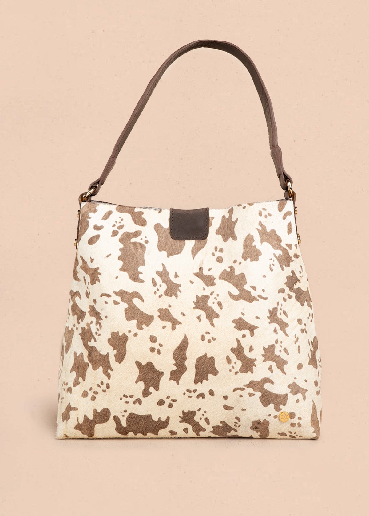 Bolso shopping de cuero café con estampado pelo de vaca 106647