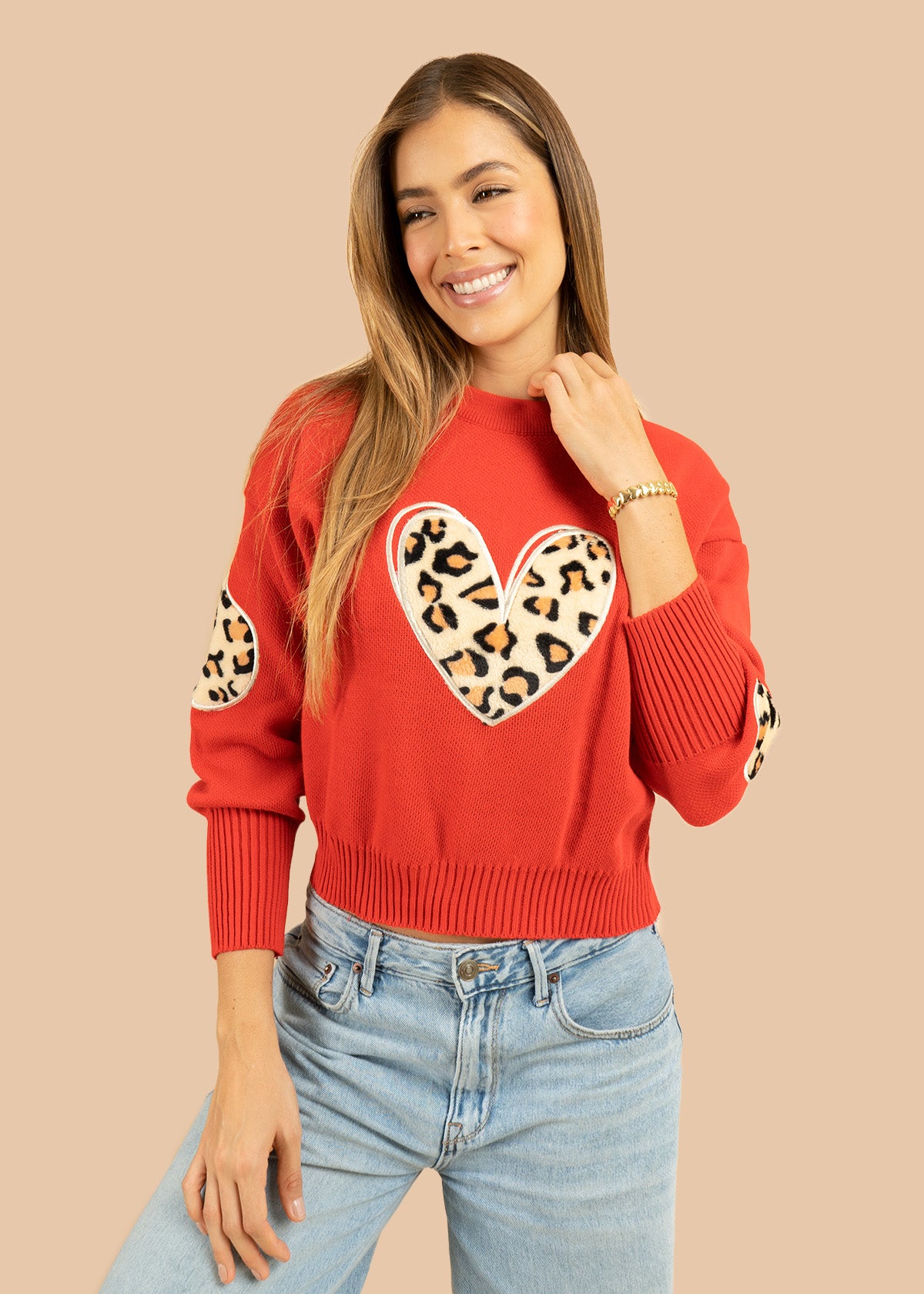 Buzo tejido color rojo con corazón en animal print 106683