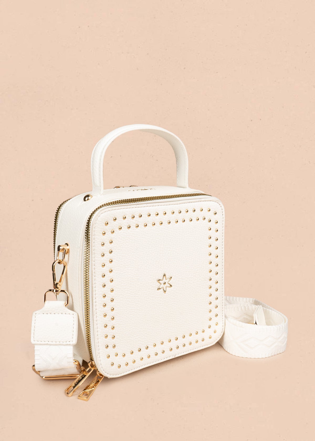 Bolso manos libres color blanco con taches 106839