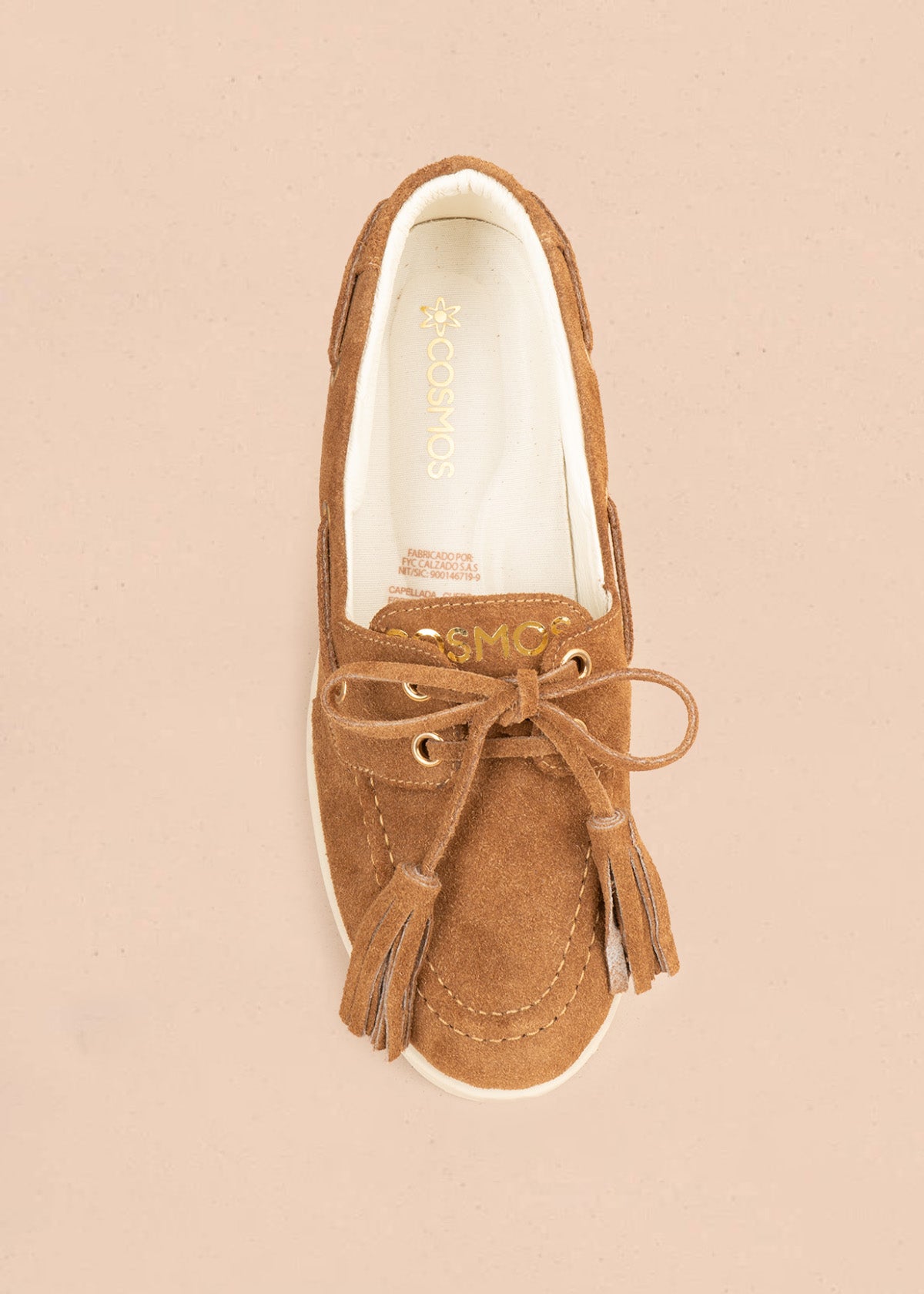 Mocasín en cuero color miel con cordón y borlas 106925