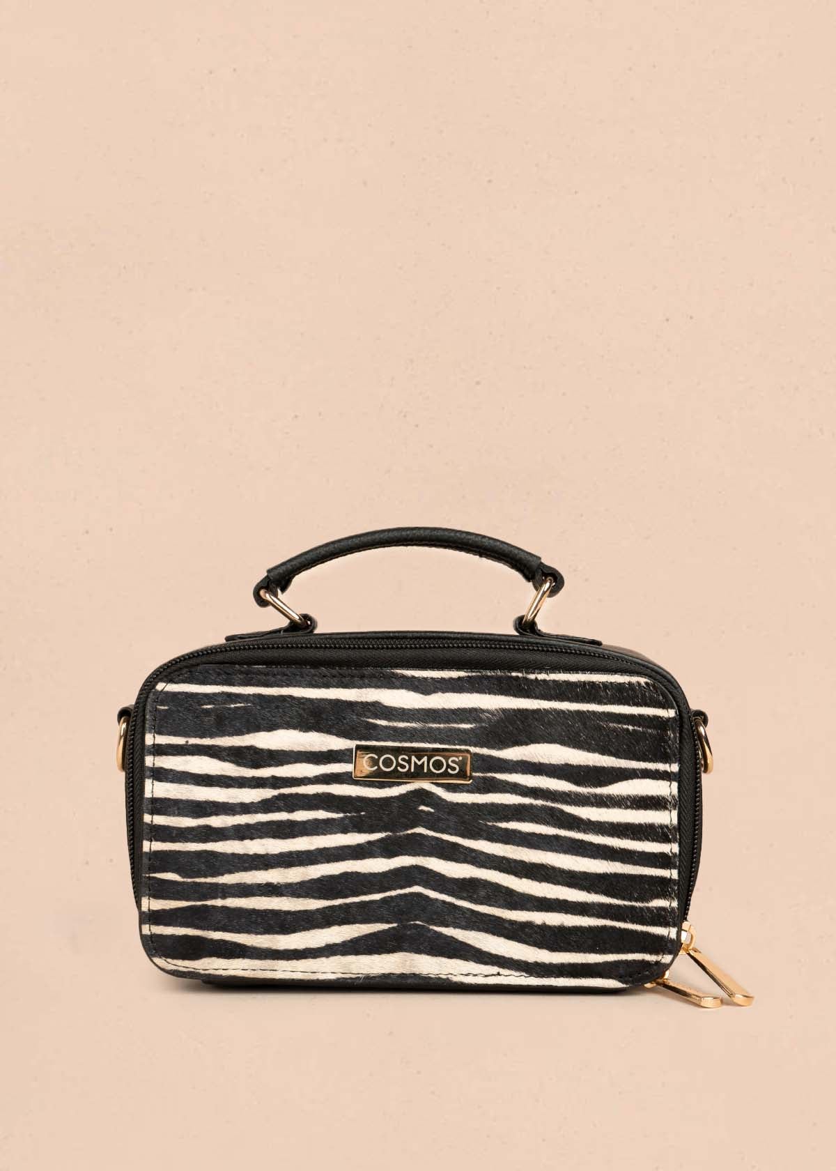 Bolso manos libres en cuero color negro y cuero con pelo animal print 105315