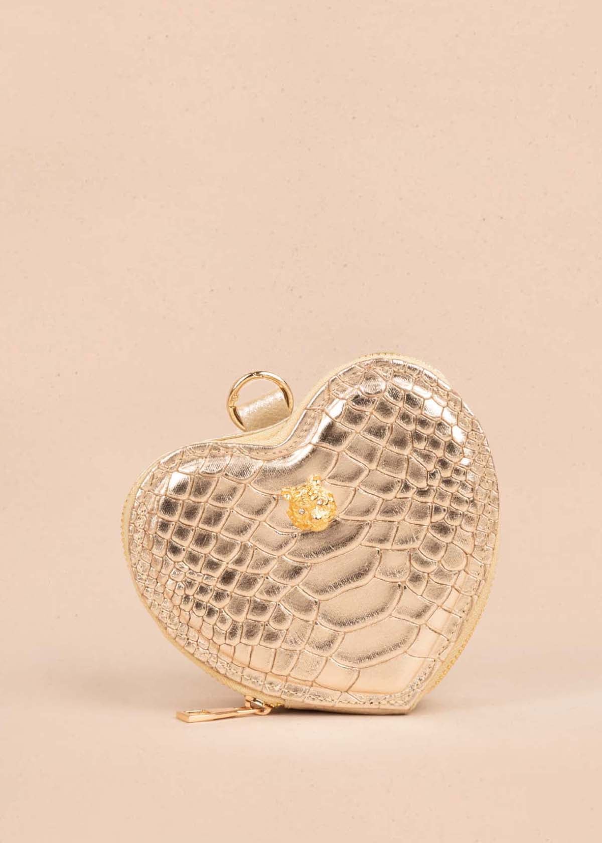 Bolso manos libres en cuero con forma de corazón color champaña 105560