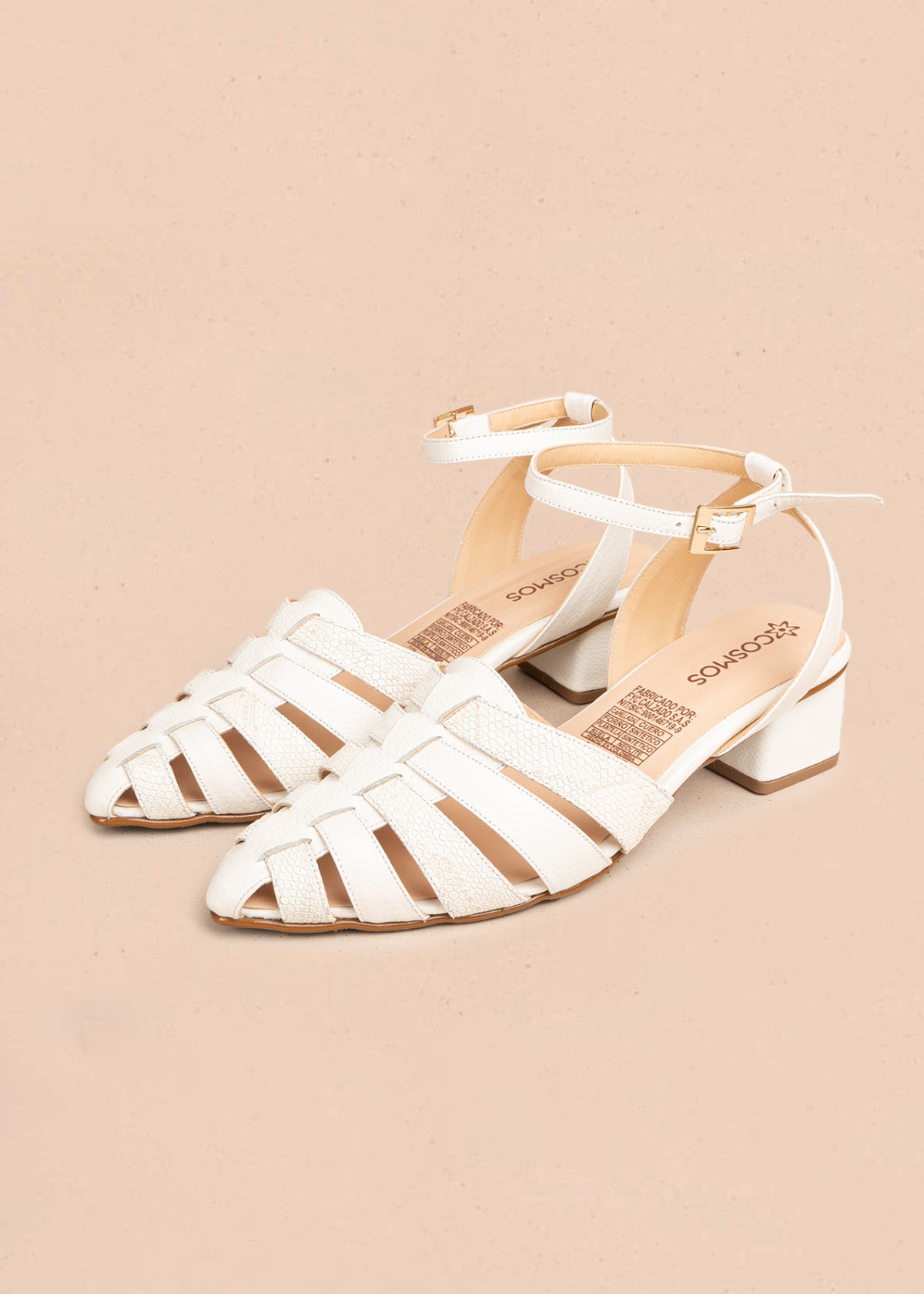 Tacones trabilla en cuero color talco con tiras cruzadas 106509
