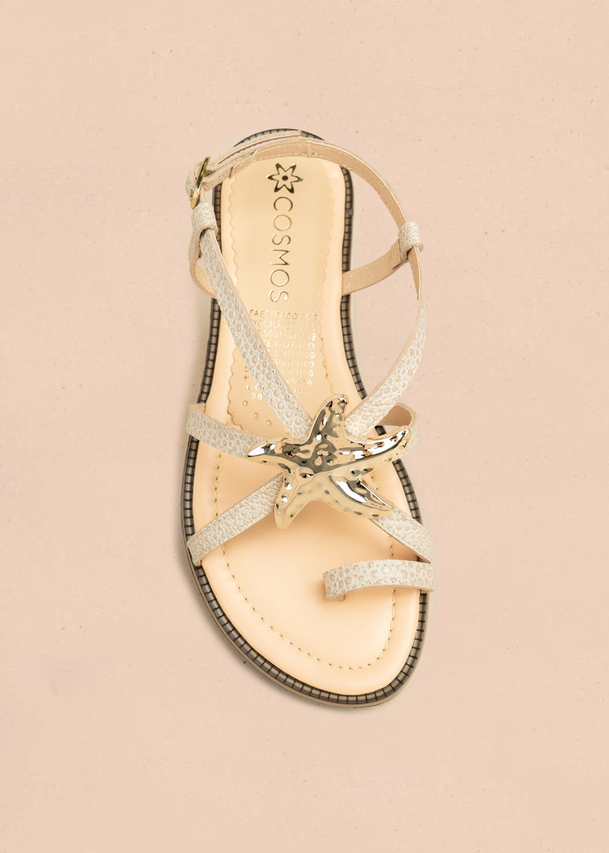 Sandalias planas color blanco con detalle de estrella marina metálica 106519