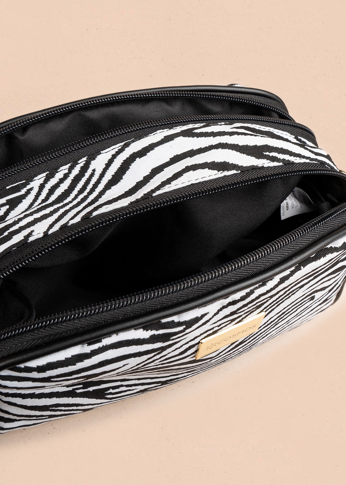 Cartera cruzada de tela color negro con estampado cebra 106654