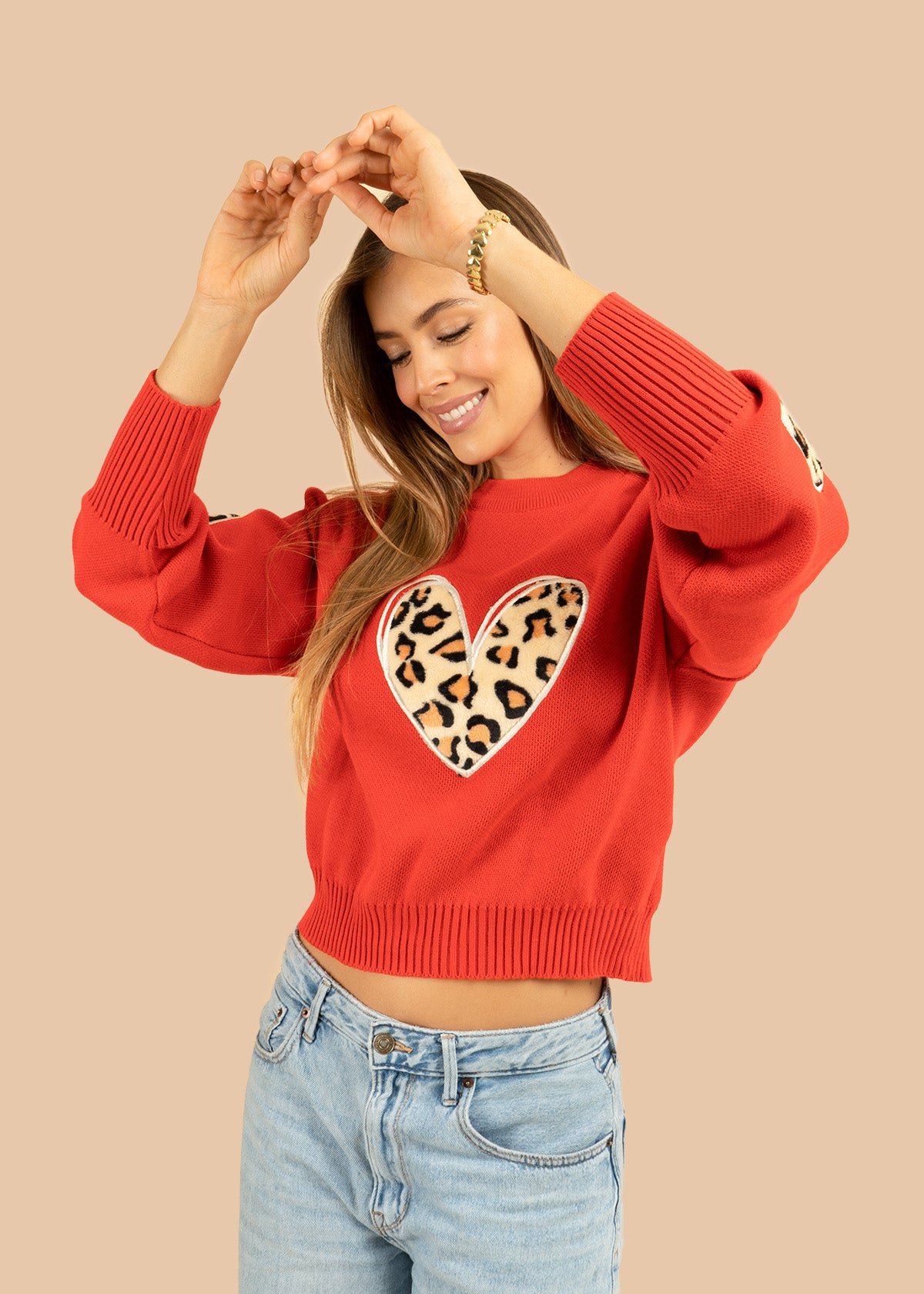 Buzo tejido color rojo con corazón en animal print 106683