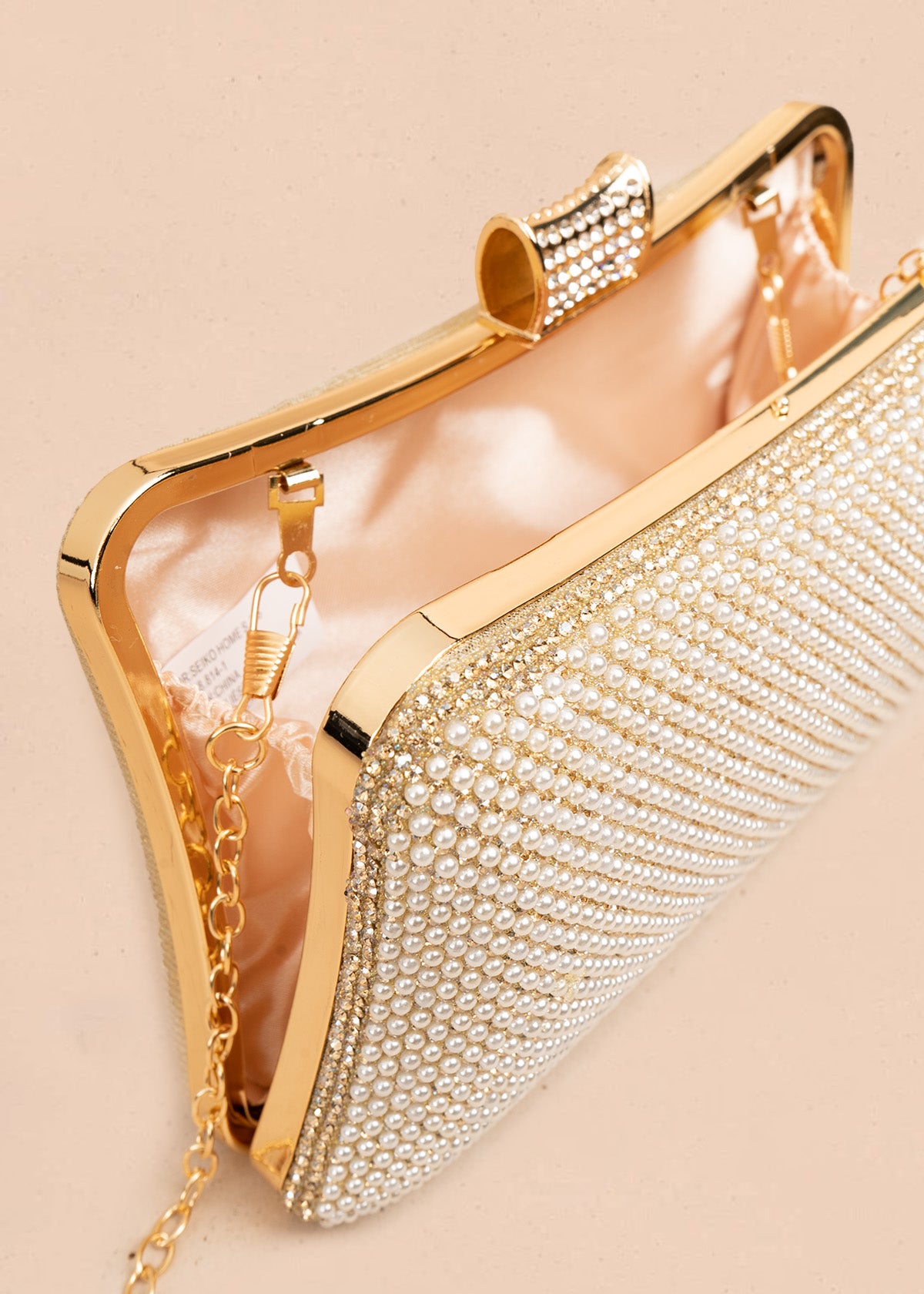 Bolso de fiesta color dorado con detalle de pedrería  106808