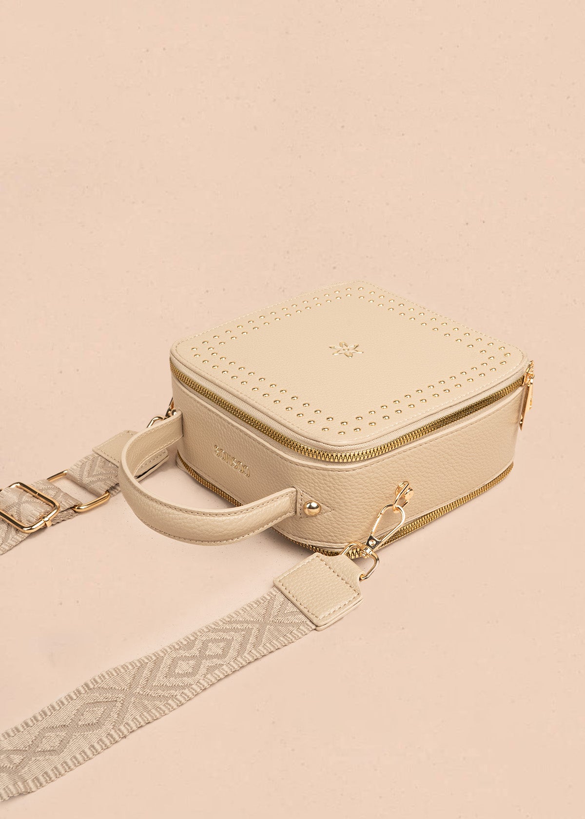 Bolso manos libres color beige con taches 106839