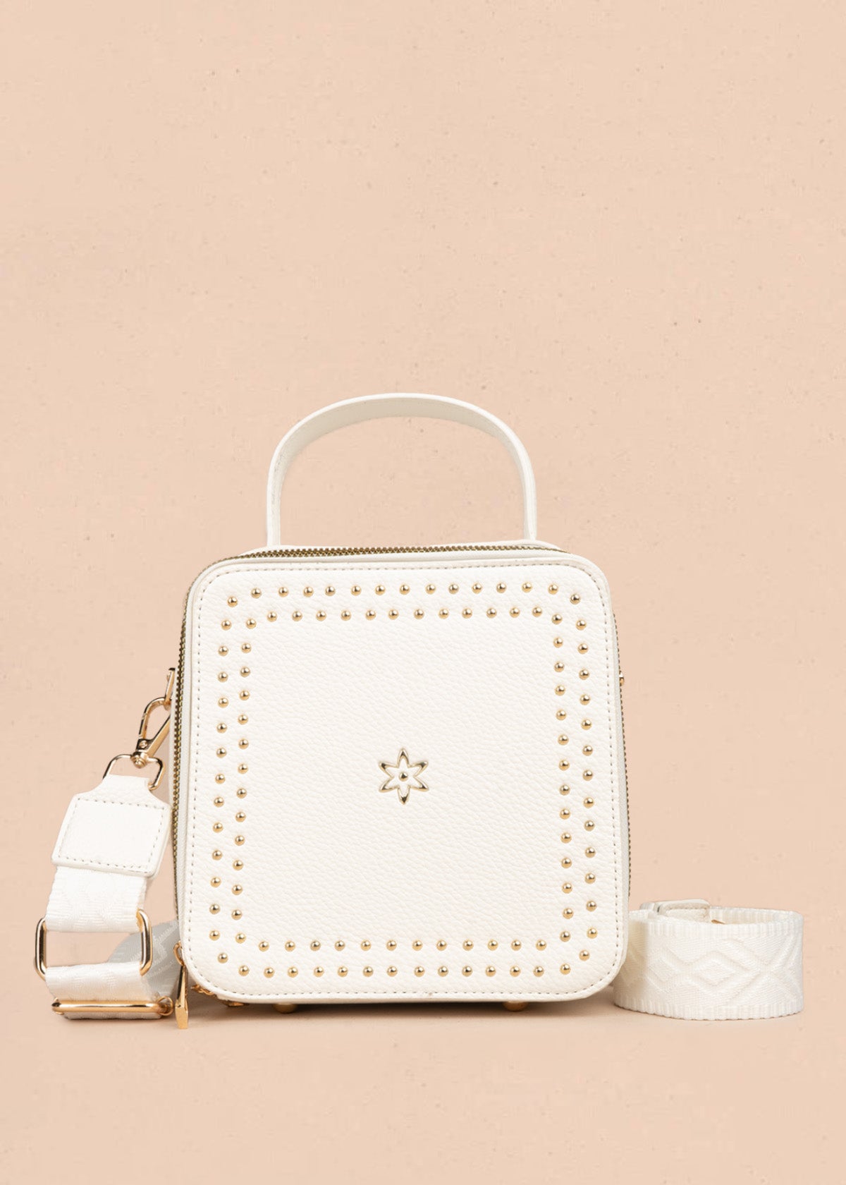 Bolso manos libres color blanco con taches 106839