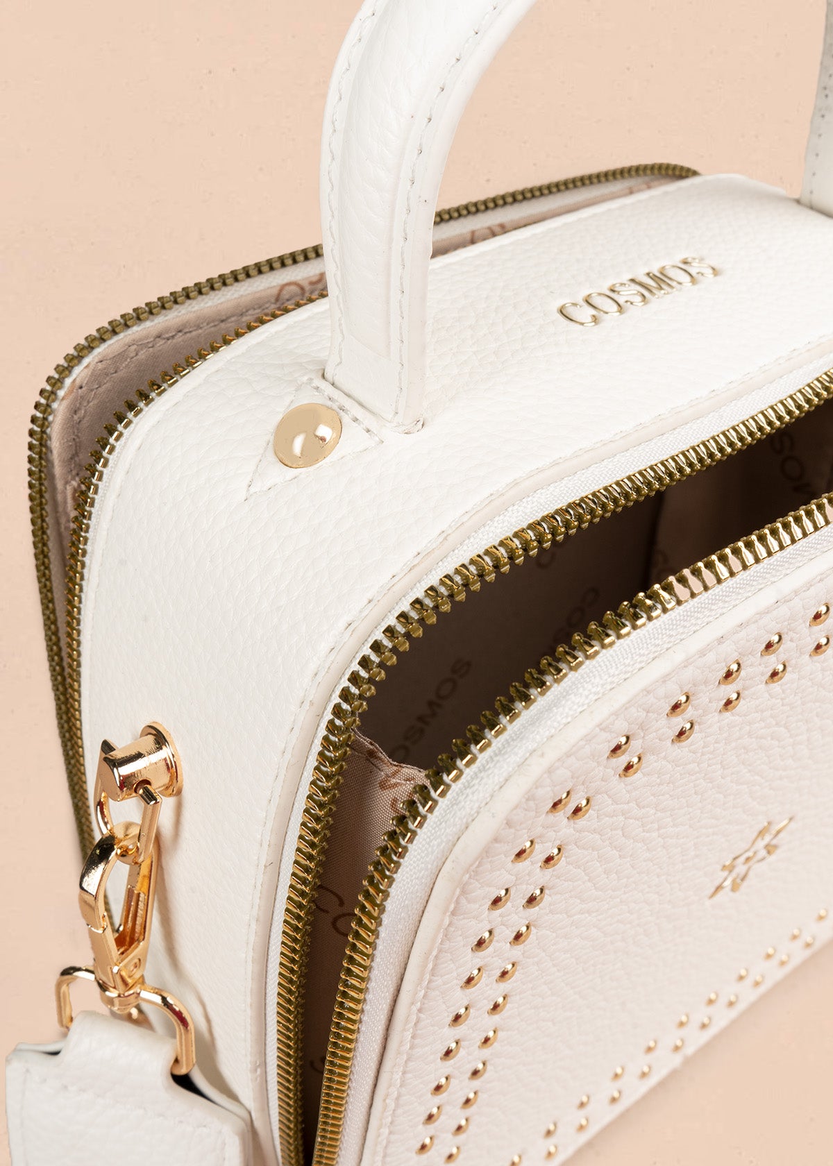 Bolso manos libres color blanco con taches 106839