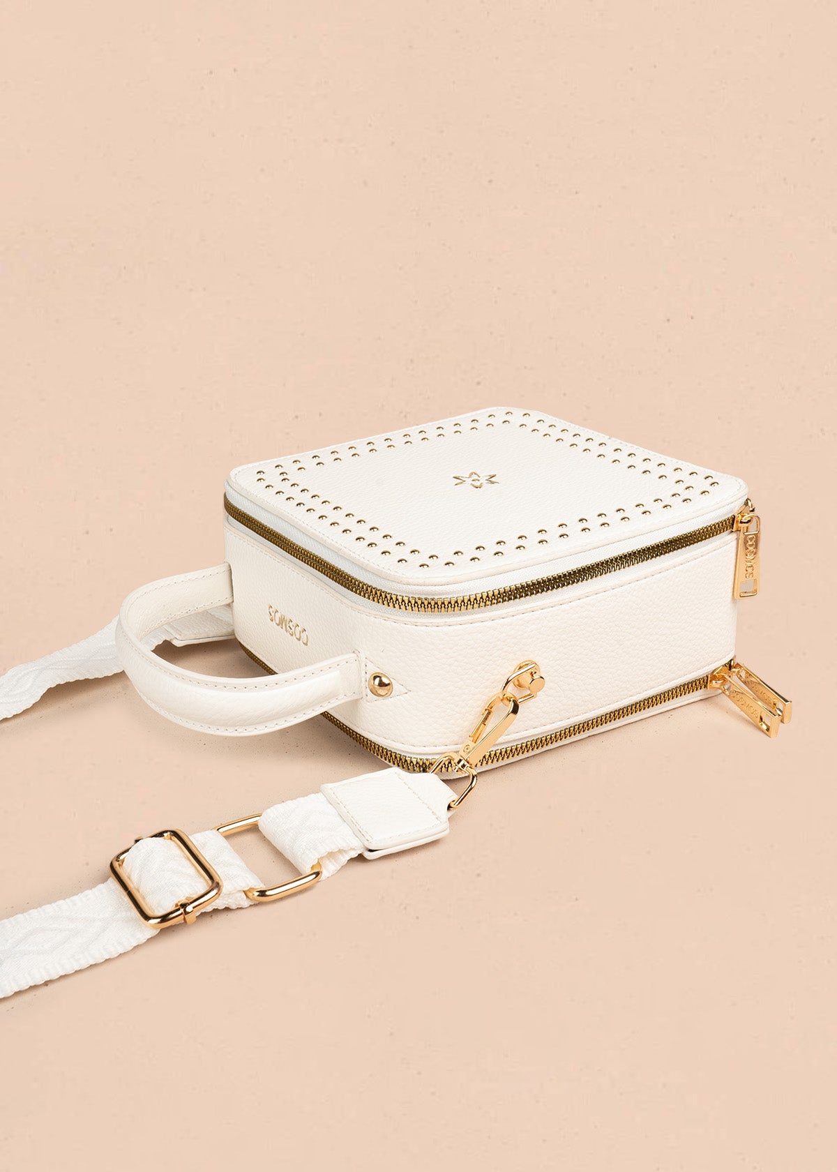 Bolso manos libres color blanco con taches 106839
