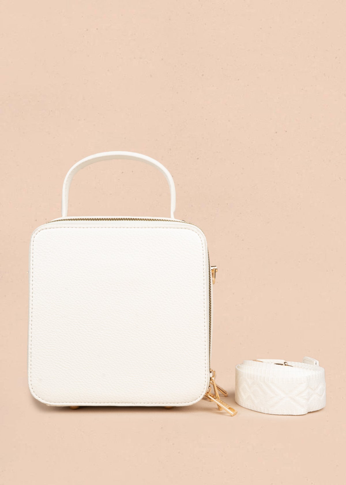 Bolso manos libres color blanco con taches 106839