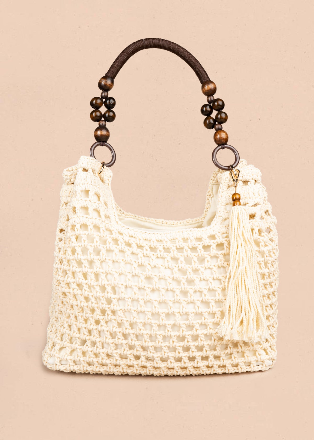 Bolso tipo shopping color marfil tejido calado con borla decorativa 106845