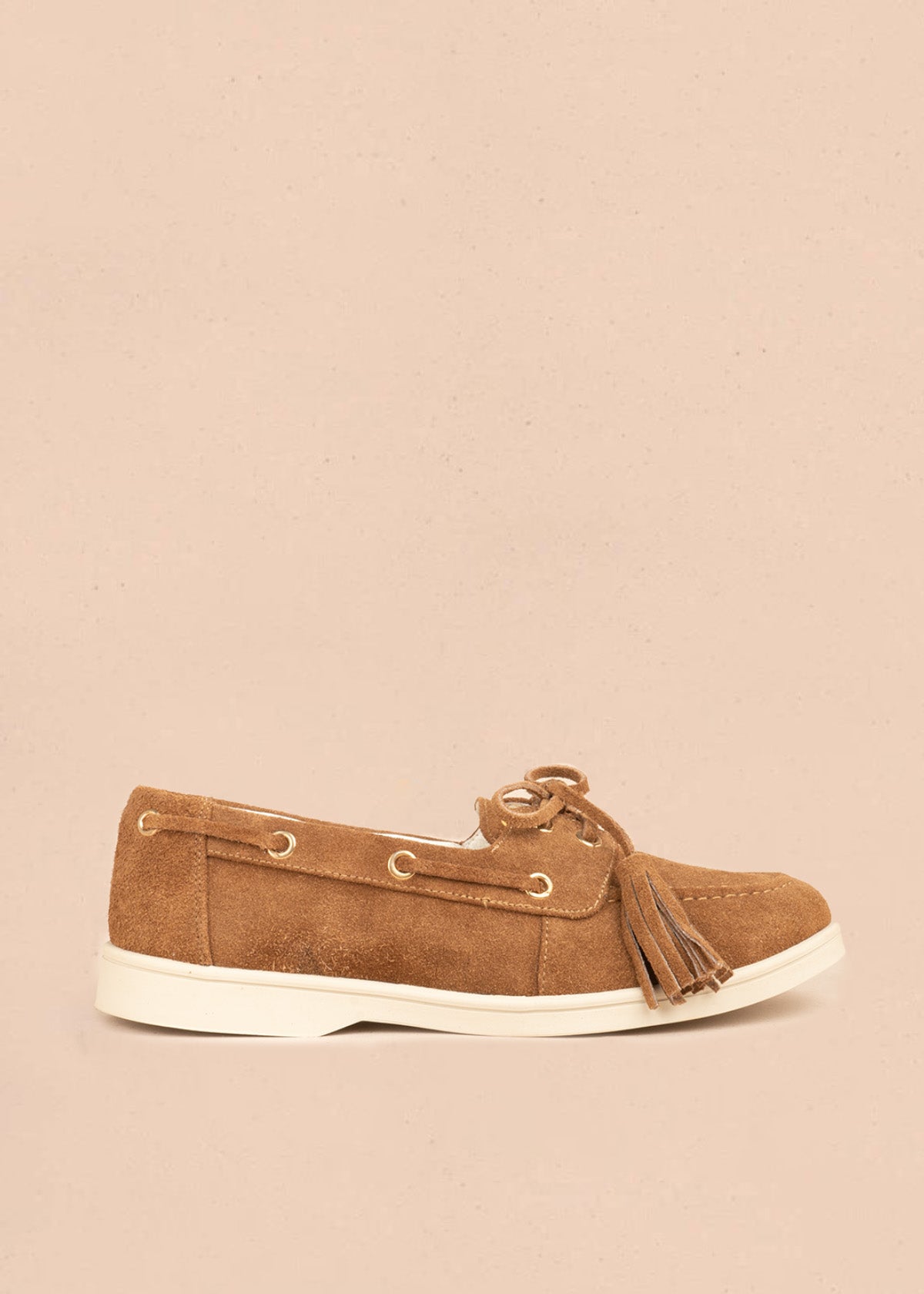 Mocasín en cuero color miel con cordón y borlas 106925